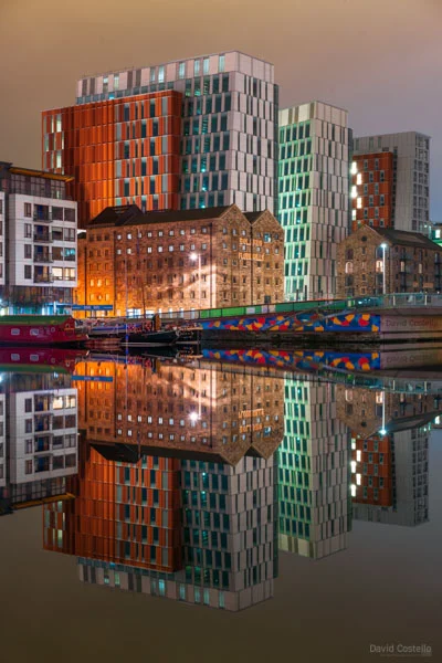 A Grand Canal Dock print with buildings and light reflecting on the still water.