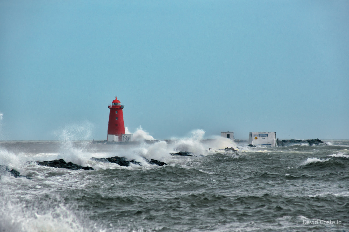 Poolbeg Lighthouse and The Great South Wall are battered by a storm and the spring tide in Dublin Bay.