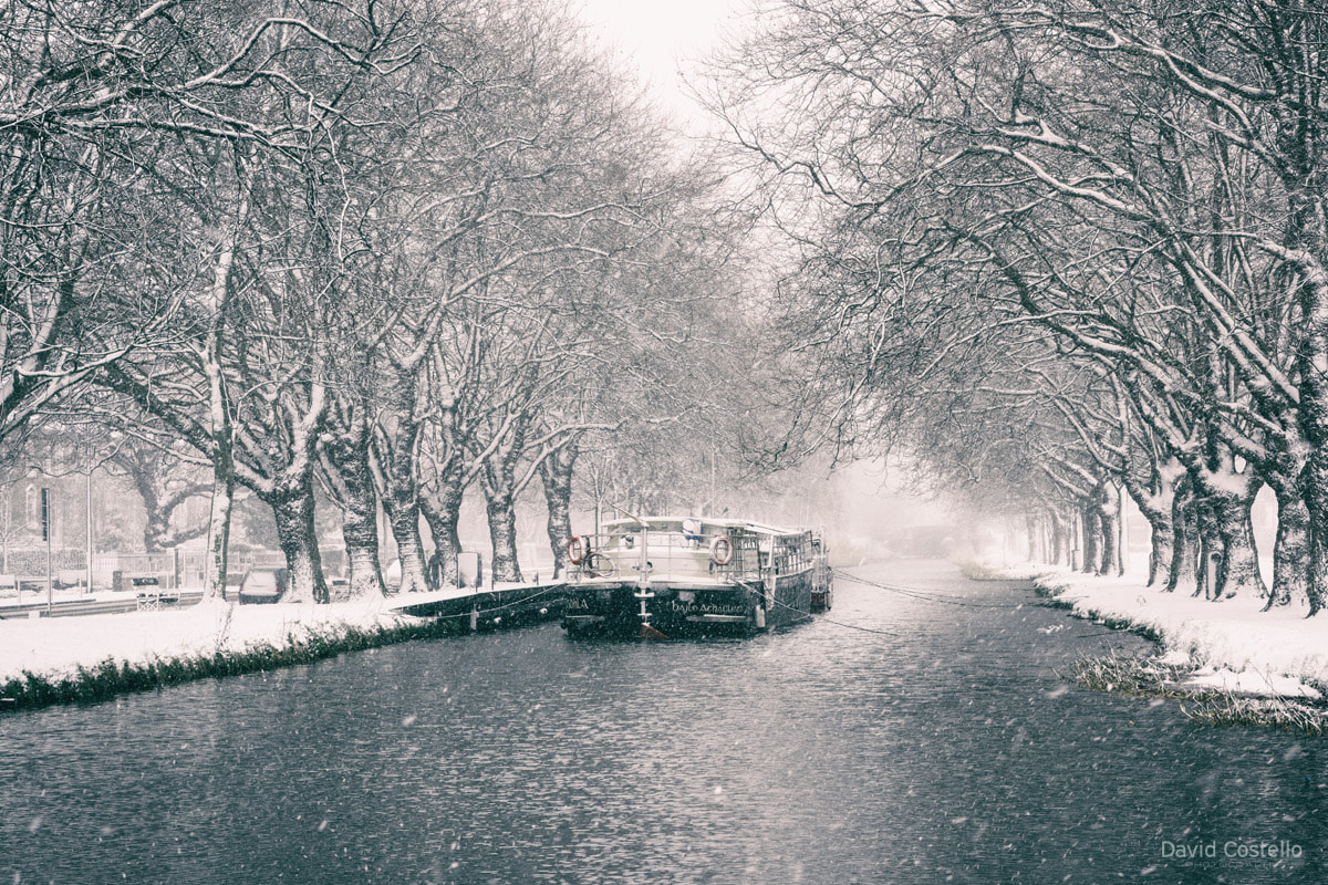 The Grand Canal and Barge in Dublin during a snowfall in the early morning on the 18th of March 2018.