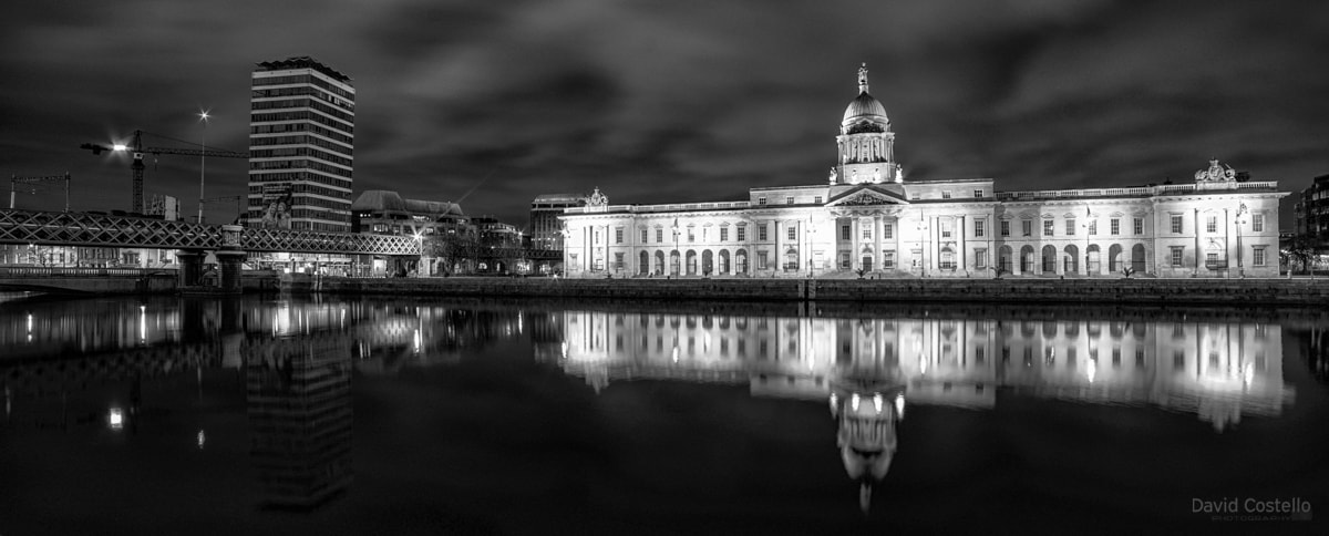 A panoramic view of Liberty Hall and The Custom House in black and white.