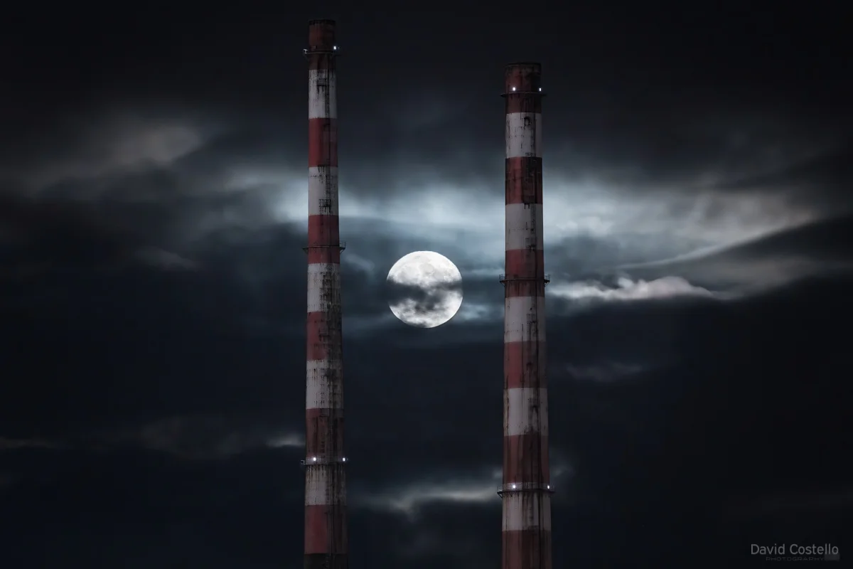 The Moonrise breaking through the clouds between the Poolbeg Towers, defusing the moon into a perfect iconic Dublin art print