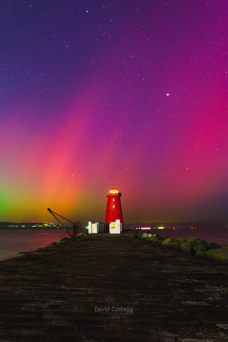 a fine art print showing the Northern Lights glowing in the Dublin sky above the Poolbeg Lighthouse.