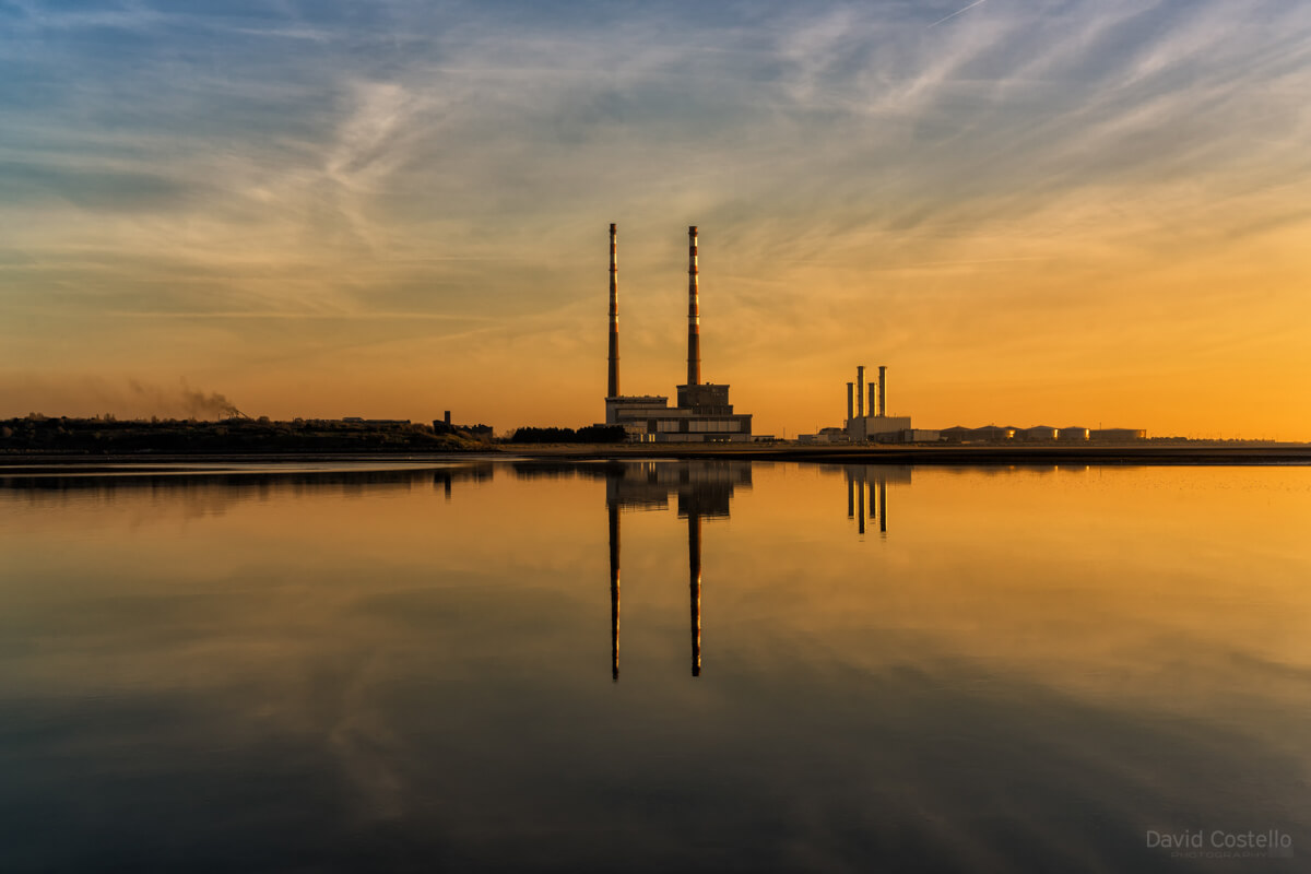 This print is a near perfect reflection of the Poolbeg Chimneys at sunrise, capturing the stillness on Sandymount Strand.