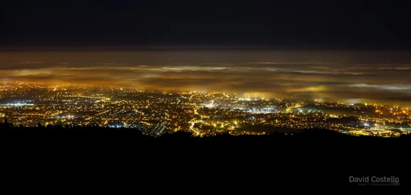 Fog rolling in over Dublin City viewed from the Dublin mountains.