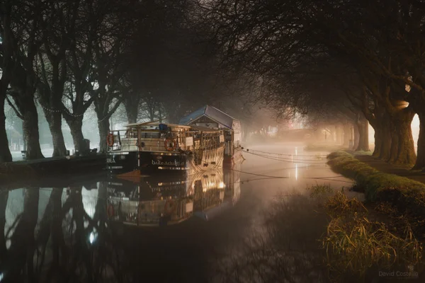 The Grand Canal in Dublin as a winter fog rises from the water on a freezing December evening in Ireland's capital city.