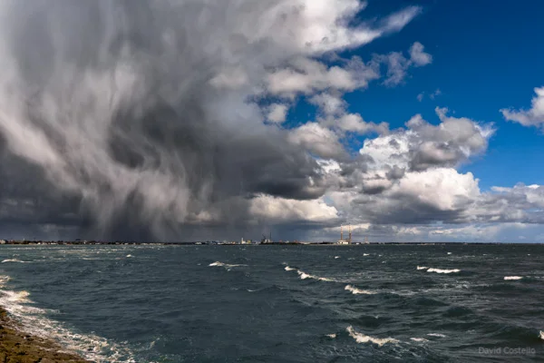 A storm rolls in over Poolbeg peninsula.