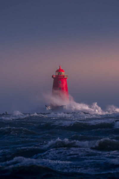 Poolbeg Lighthouse as the sun faded, the waves swelled and the rain arrived during storm Barra.